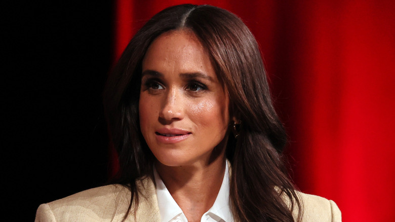 Meghan Markle listens during an interview