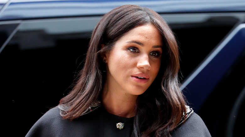 Meghan Markle looking a bit down in black