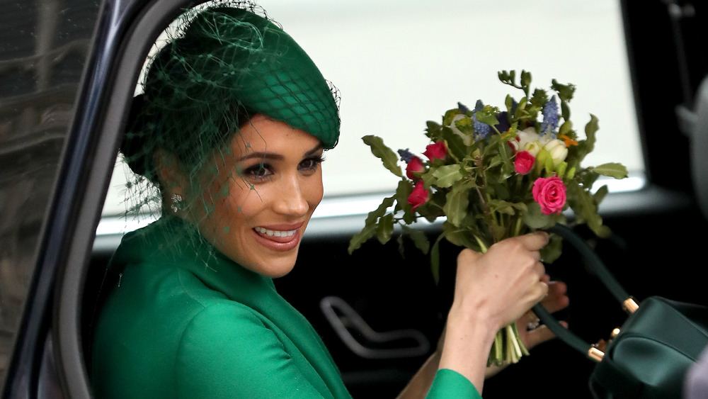 Meghan Markle holding flowers