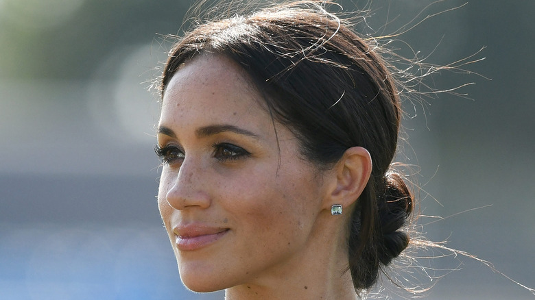 Meghan Markle looks off into the distance