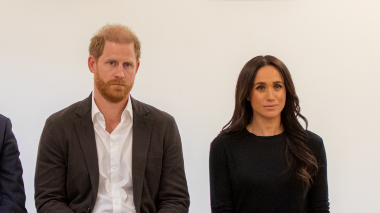 Prince Harry and Meghan Markle sitting