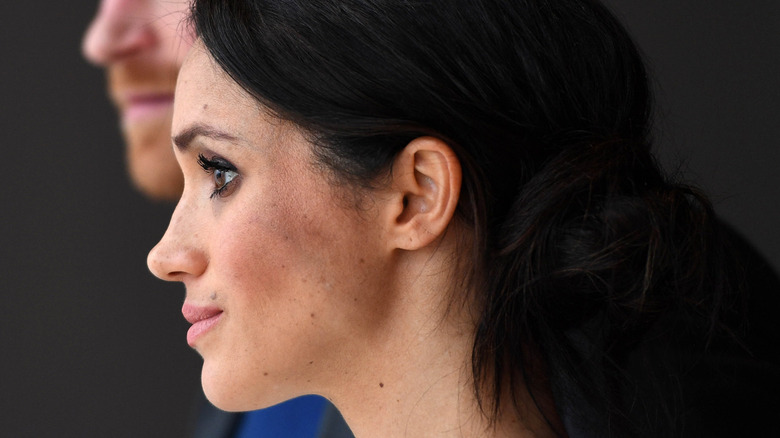 Closeup side profile of Meghan Markle