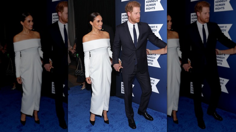 Meghan Markle wearing white while walking with Prince Harry