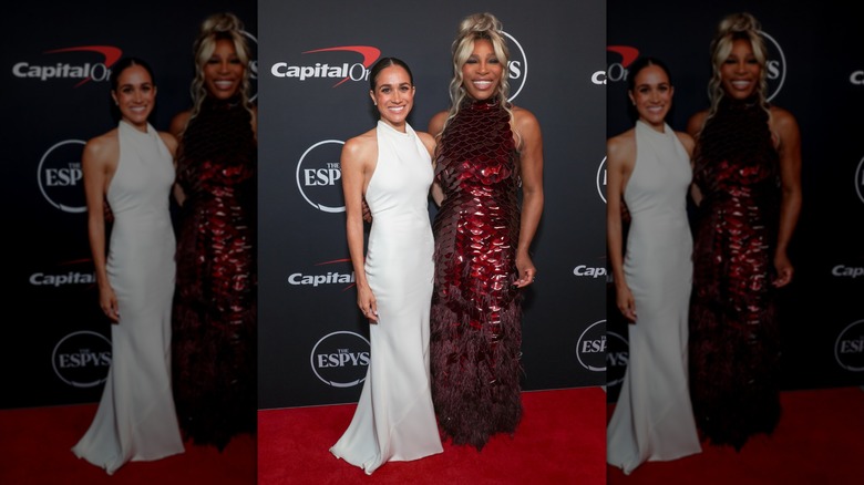 Meghan Markle and Serena Wlliams posing on the red carpet together in high-neck gowns