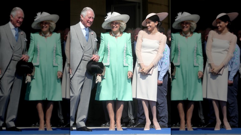 Meghan Markle standing with King Charles III and Queen Camilla