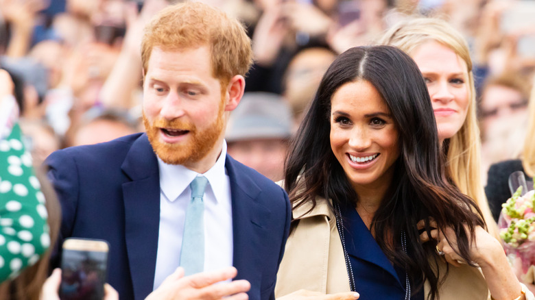 Meghan Markle and Prince Harry meeting fans in Australia