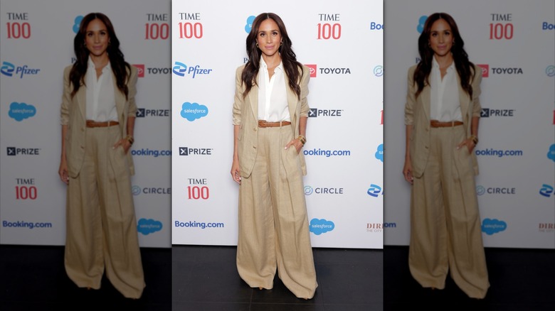 Meghan Markle posing in tan pantsuit at Time 100 event