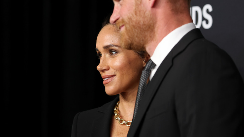 Meghan Markle and Prince Harry, photographed from the side