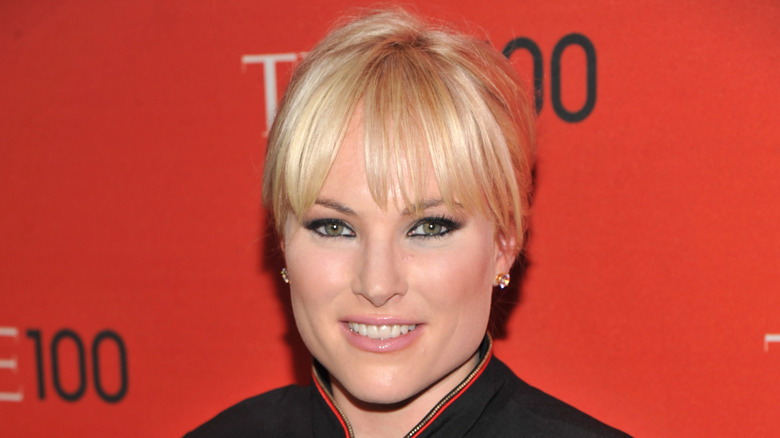 Meghan McCain wears dark eyeliner on her upper and lower lash lines with her hair pulled back.