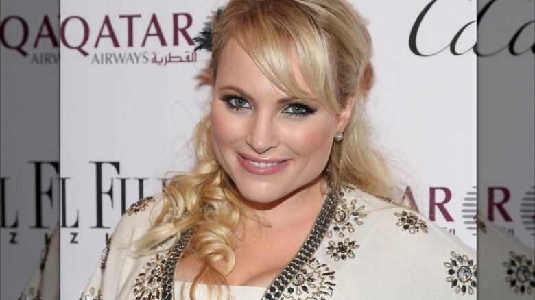 Meghan McCain wears her hair styled with side-swept bangs and long curls.