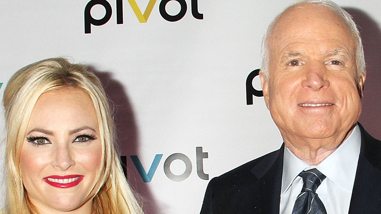 Meghan McCain and John McCain posing 