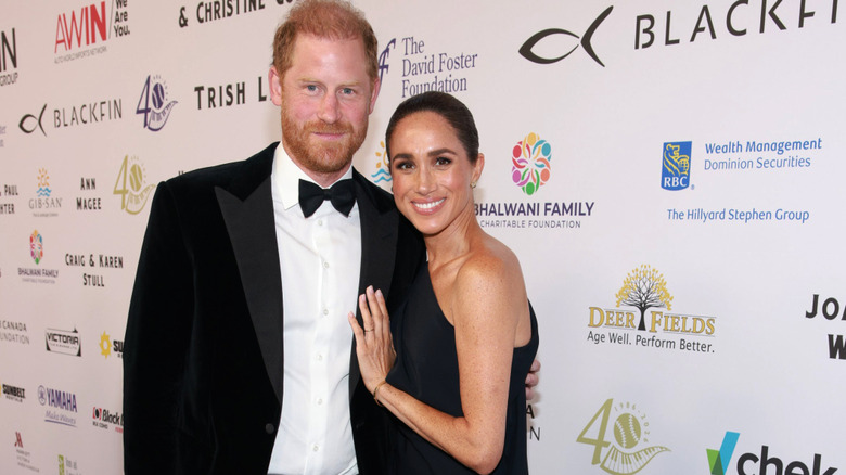 Prince Harry and Meghan Markle posing together at a David Foster Foundation event in 2026