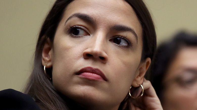 AOC looks concerned during hearings