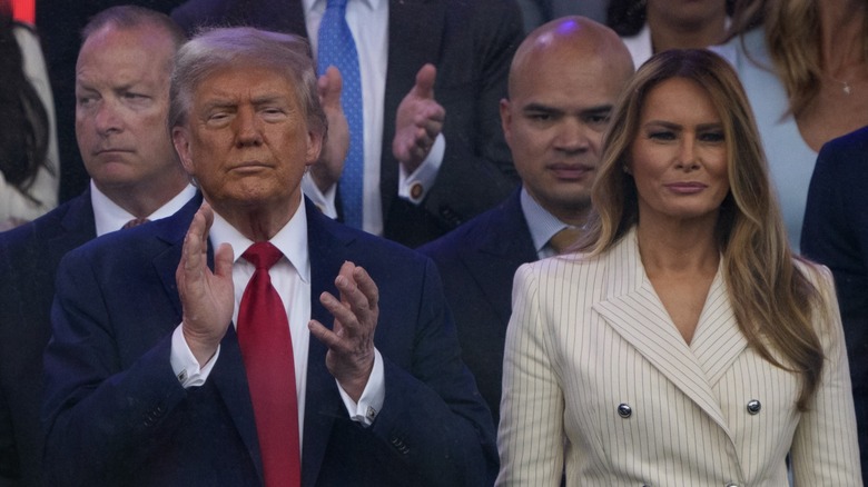 Donald Trump and Melania Trump stand during a military parade in Washington, DC (2025)