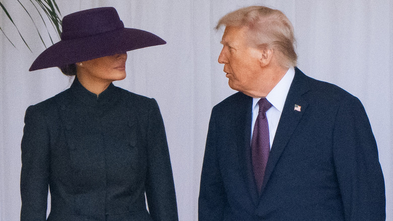 Donald Trump talking to Melania Trump