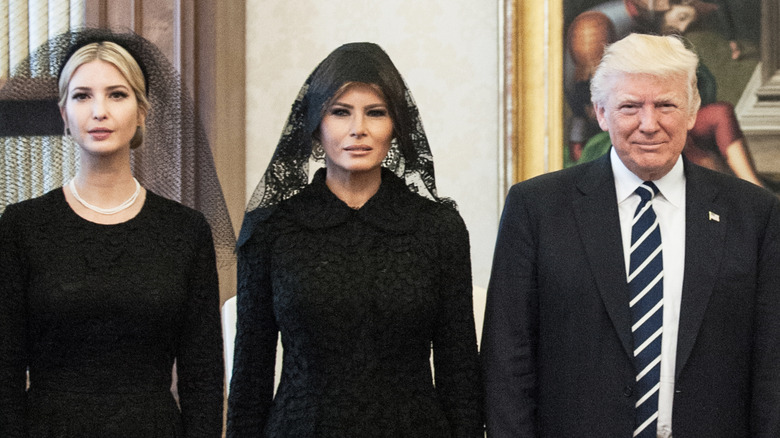 Ivanka, Melania, and Donald Trump staring