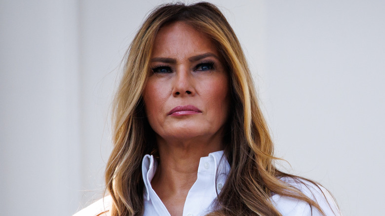 Melania Trump listens as Donald Trump delivers remarks during an Independence Day military family picnic on the South Lawn of the White House on July 04, 2025 in Washington, DC.
