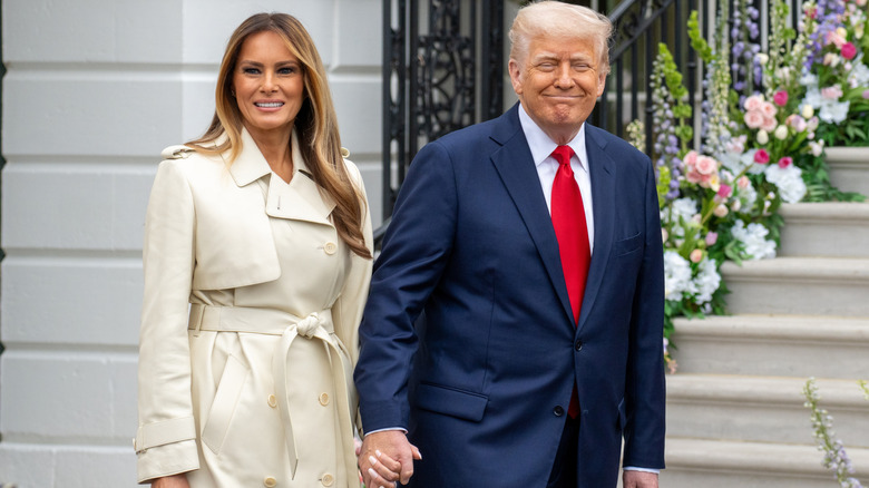 Melania Trump and Donald Trump holding hands at the 2025 White House Easter Egg Roll