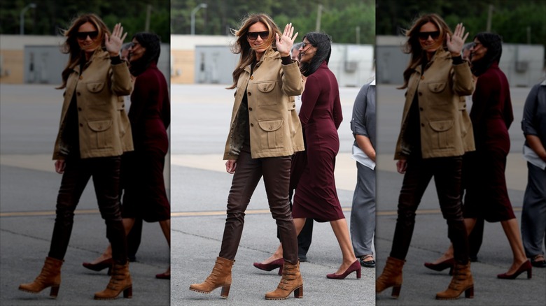Melania Trump waves while Usha Vance walks behind her