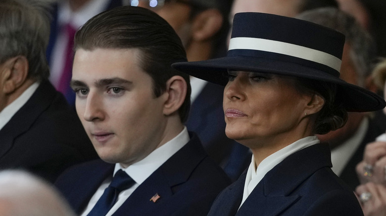 Barron and Melania Trump sitting at Donald Trump's 2025 inauguration