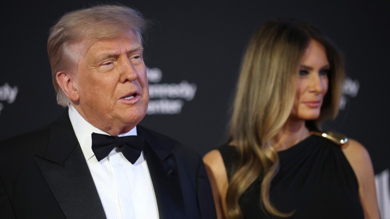 Donald Trump and Melania Trump posing on the Kennedy Center red carpet on June 11, 2025