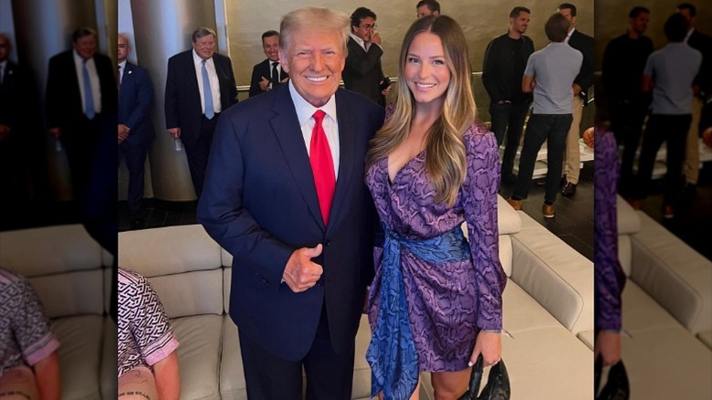 Donald Trump gives a thumbs up while side hugging Margo Martin in Miami, FL (2023)