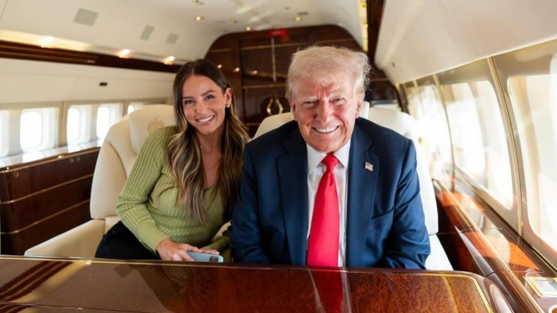 Margo Martin and Donald Trump sit next to each other on a private jet (2024)