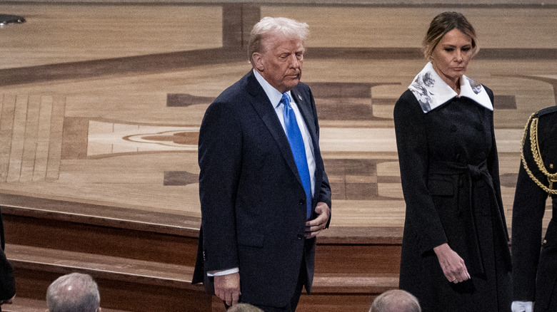 Donald and Melania Trump walking