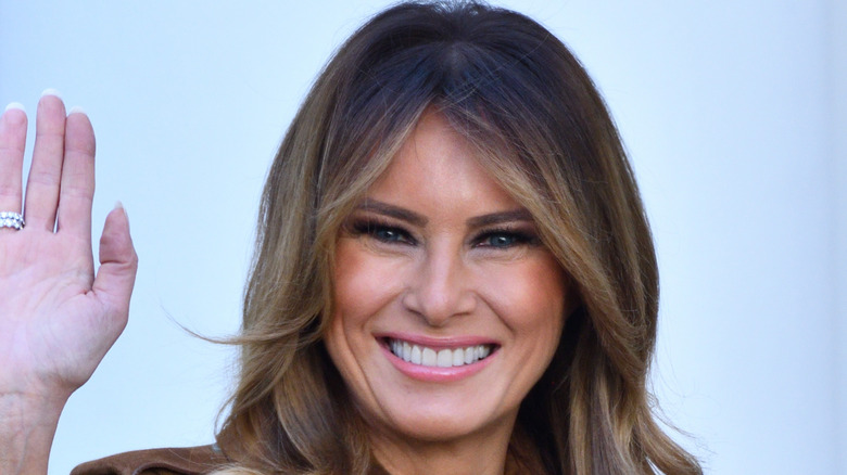 Melania Trump smiling and waving