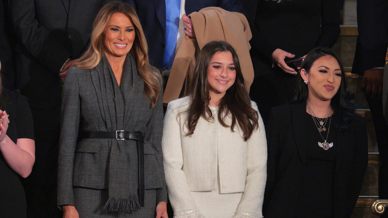 Melania Trump wearing a gray suit dress and scarf during Donald Trump's address to a joint session of Congress