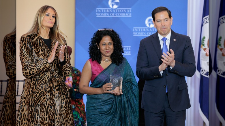Melania Trump and Marco Rubio clapping beside International Women of Courage Award recipient Namini Wijedasa