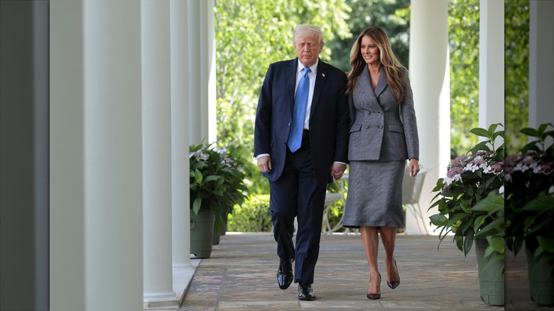 Donald Trump and Melania Trump holding hands