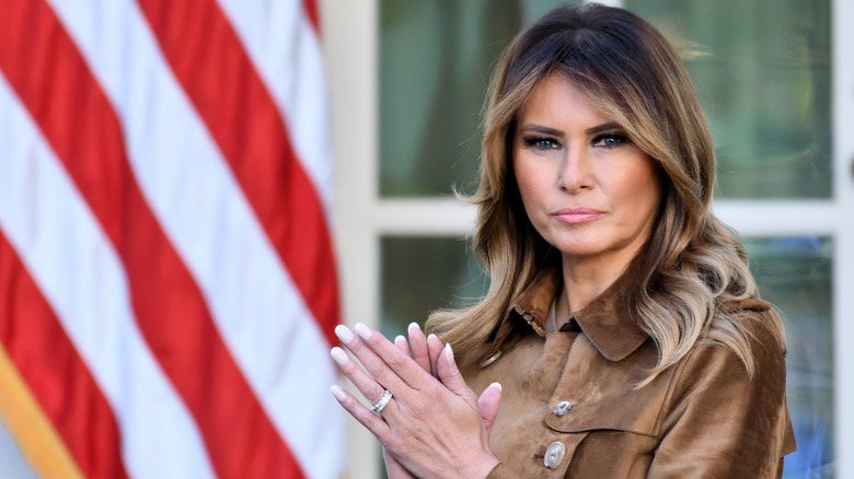 Melania Trump standing in the White House rose garden