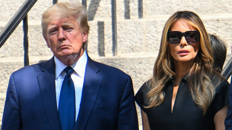 Donald Trump and Melania Trump outside a funeral