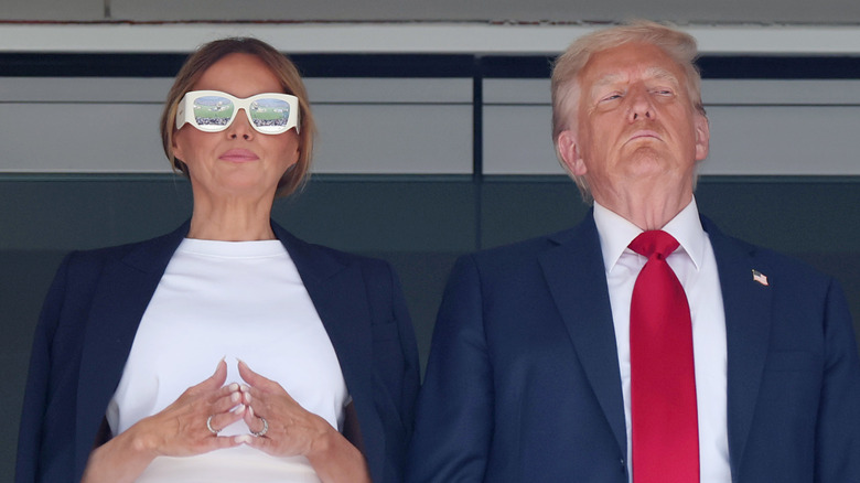 Melania and Donald Trump standing next to each other