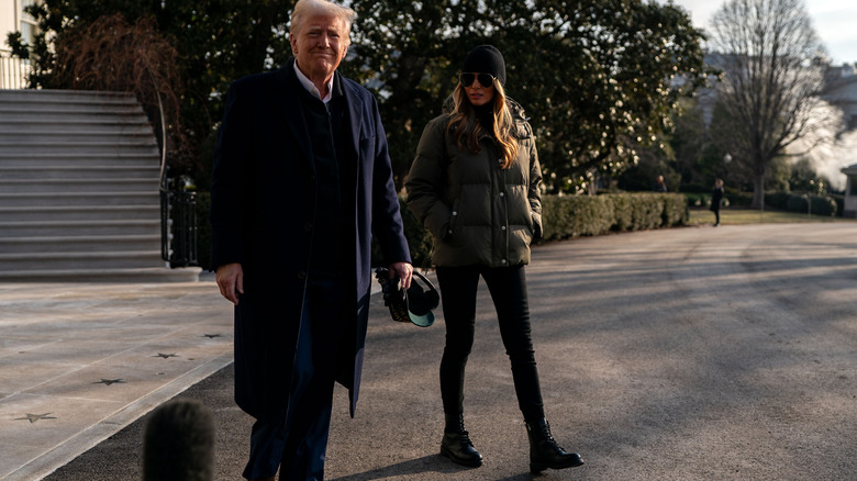 Melania and Donald Trump dressed in winter clothes at the White House