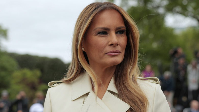 First lady Melania Trump looks on as U.S. President Donald Trump greets guests durning the White House Egg Roll on the South Lawn of the White House on April 21, 2025 in Washington, DC (2025)