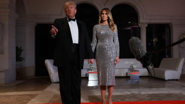 Donald Trump and Melania Trump arrive for a New Year's Eve event at Mar-A-Lago in Florida (2022)