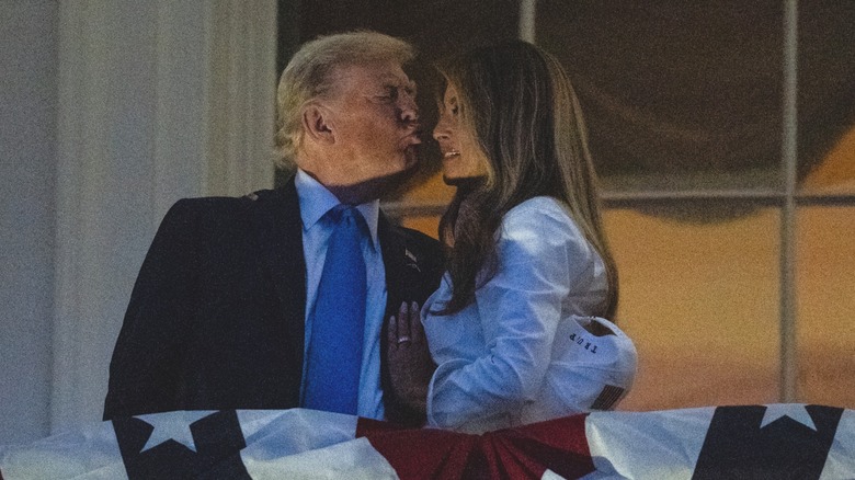 Donald Trump puckering up to kiss Melania Trump on White House balcony