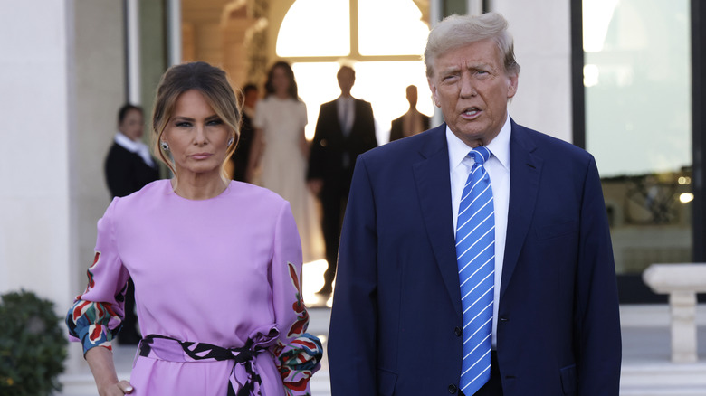 Melania and Donald Trump frowning
