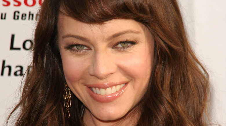 Melinda Clarke poses at an event 