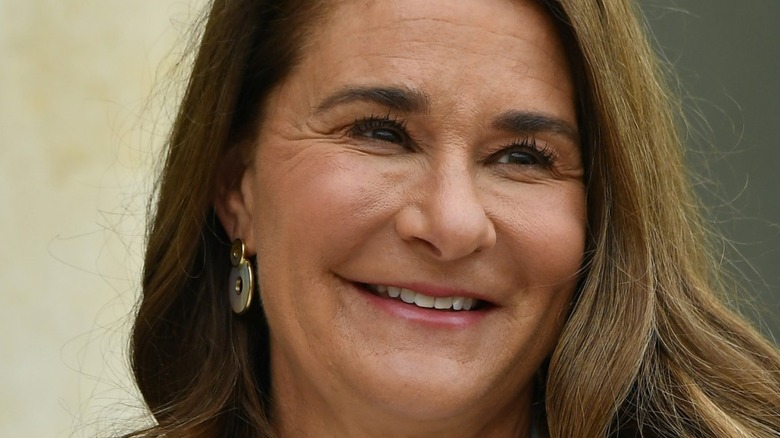 Melinda Gates smiling and looking away from camera