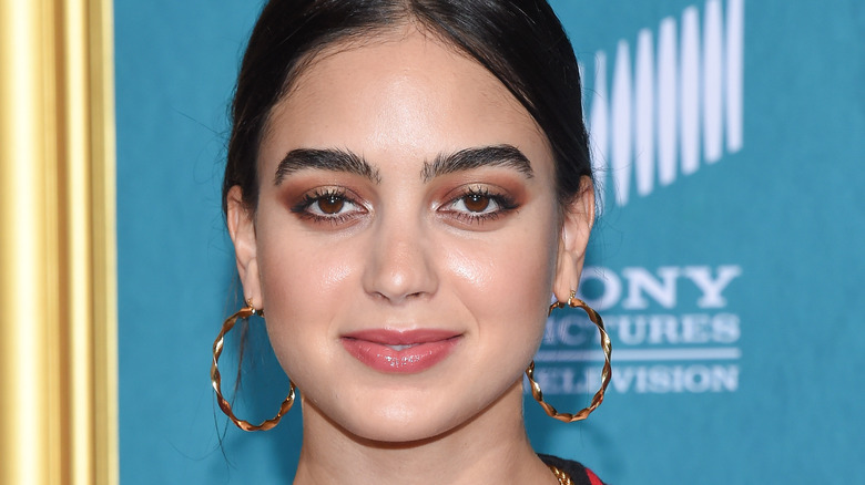 Melissa Barrera in gold hoop earrings