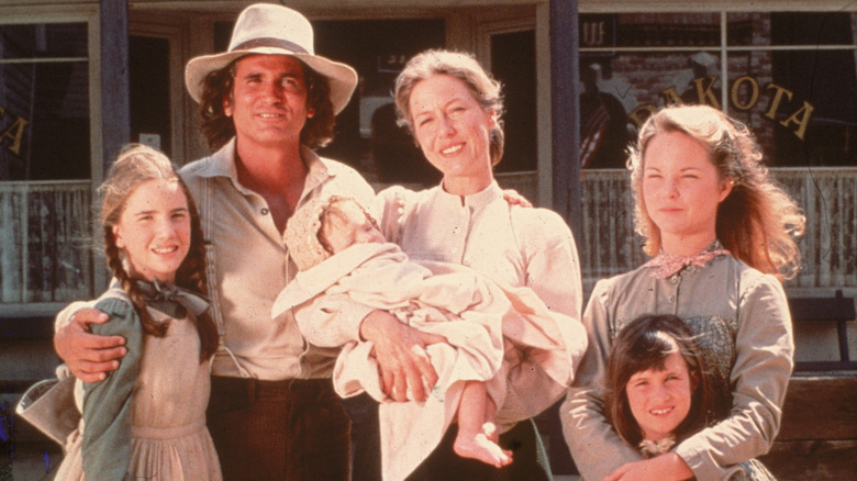 The cast of the original 'Little House on the Prairie' (1974) in costume on the show's set