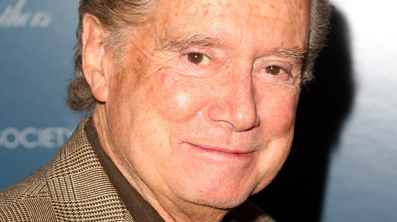 Regis Philbin smiles at an event