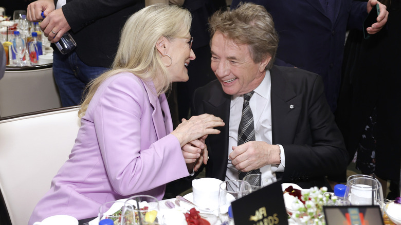 Meryl Streep and Martin Short sharing a laugh at the AFI Awards luncheon in 2024