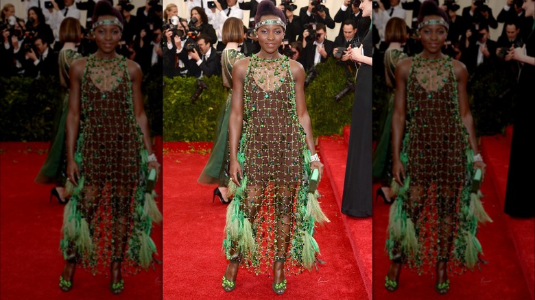 Lupita Nyong'o in a green and brown outfit