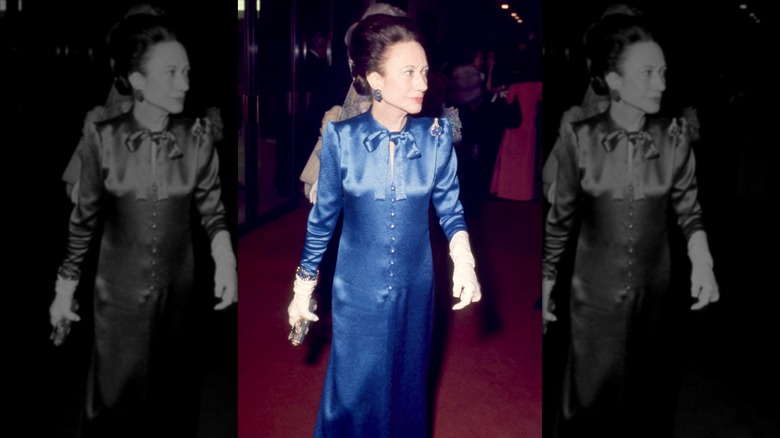American socialite, wife of former king Edward VIII and Duchess of Windsor, Wallis Simpson, attending the Met Gala wearing a blue floor-length dress and white evening gloves