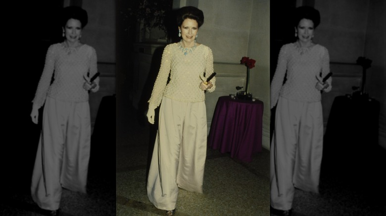 Style icon and charity chairwoman Jean Tailer wearing a jeweled top and satin pants by Adolfo at the Metropolitan Museum of Art Gala in 1979