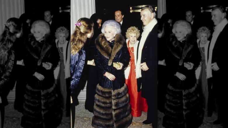 Doris Stein in a full-length black coat with fur trim at the 1979 Met Gala